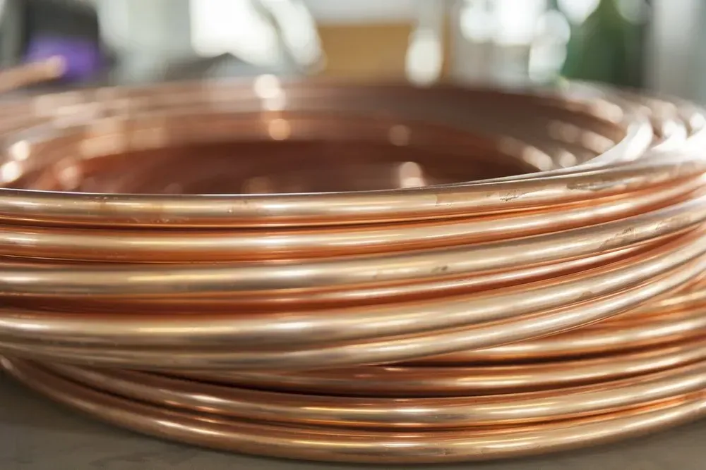 Coiled Copper Tubing, Shiny Orange-brown, Tightly Wound on a Surface — Independent Scrap Metal Pty Ltd in Mullumbimby, NSW