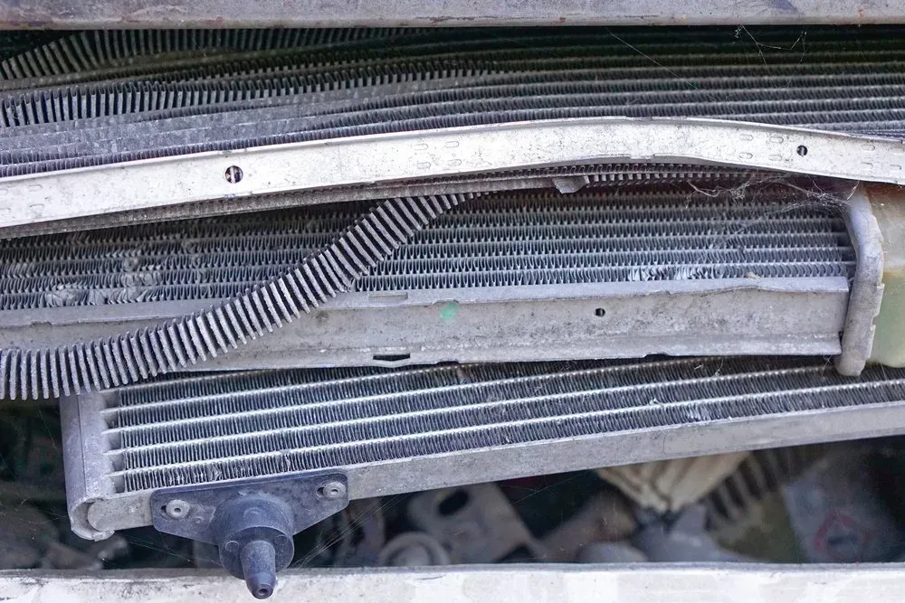 Damaged Vehicle Radiator With Bent Fins and Debris — Independent Scrap Metal Pty Ltd in Bangalow, NSW