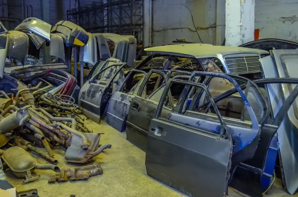 Pile of Car Doors and Parts in a Cluttered Junkyard Warehouse — Independent Scrap Metal Pty Ltd in Clarence Valley, NSW