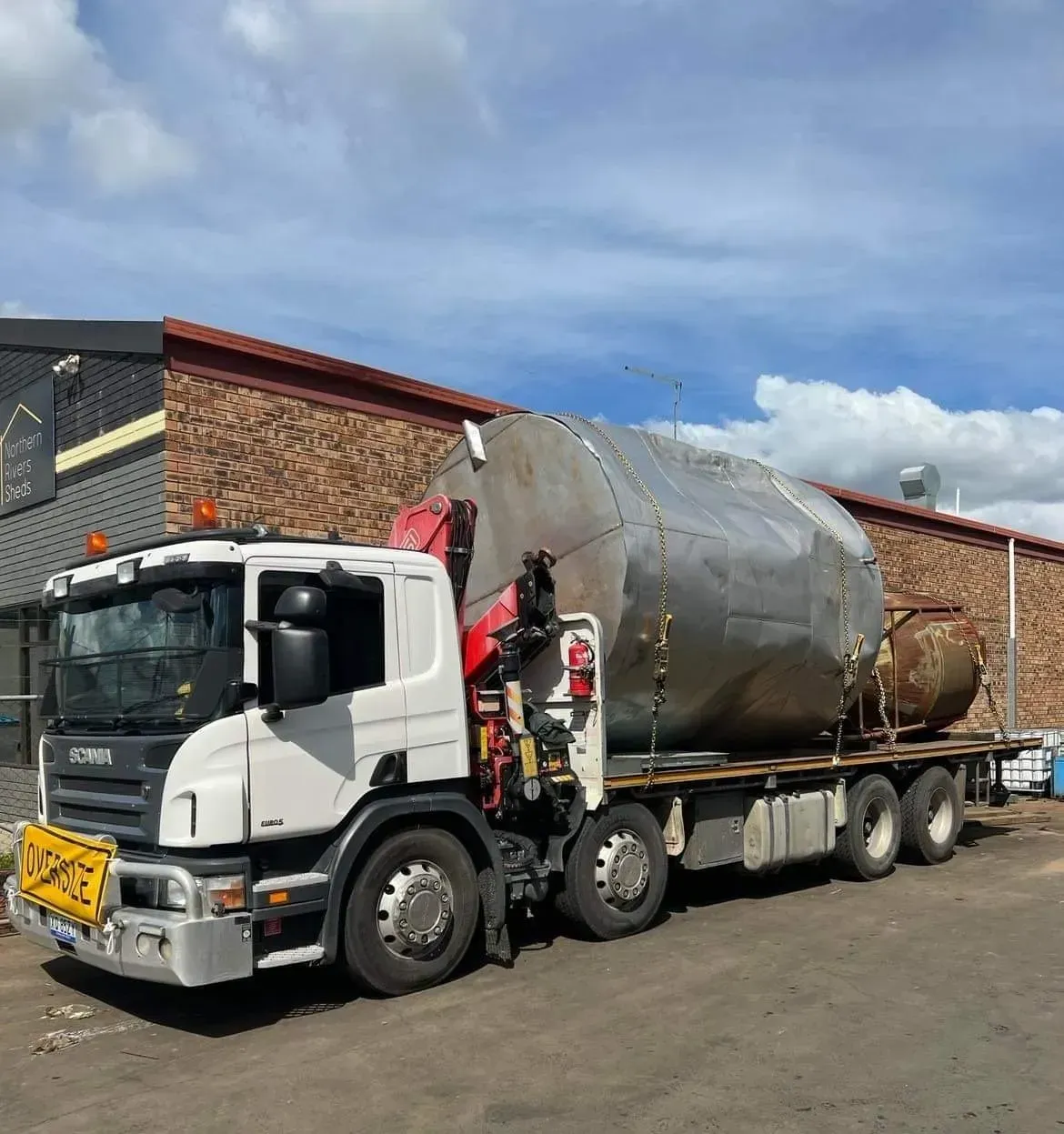 A Large Metal Tank Loaded on a Flatbed Truck — Independent Scrap Metal Pty Ltd in South Lismore, NSW
