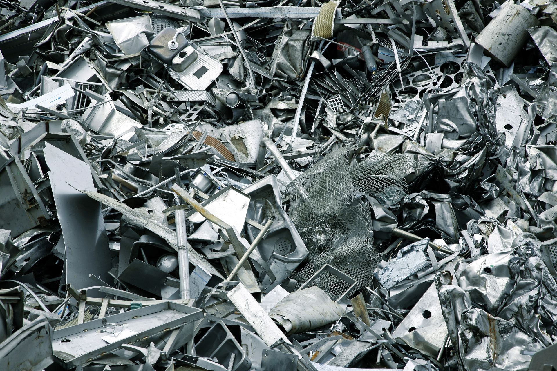 Pile of Assorted Scrap Metal, Reflecting a Dull, Metallic Sheen — Independent Scrap Metal Pty Ltd in Bangalow, NSW