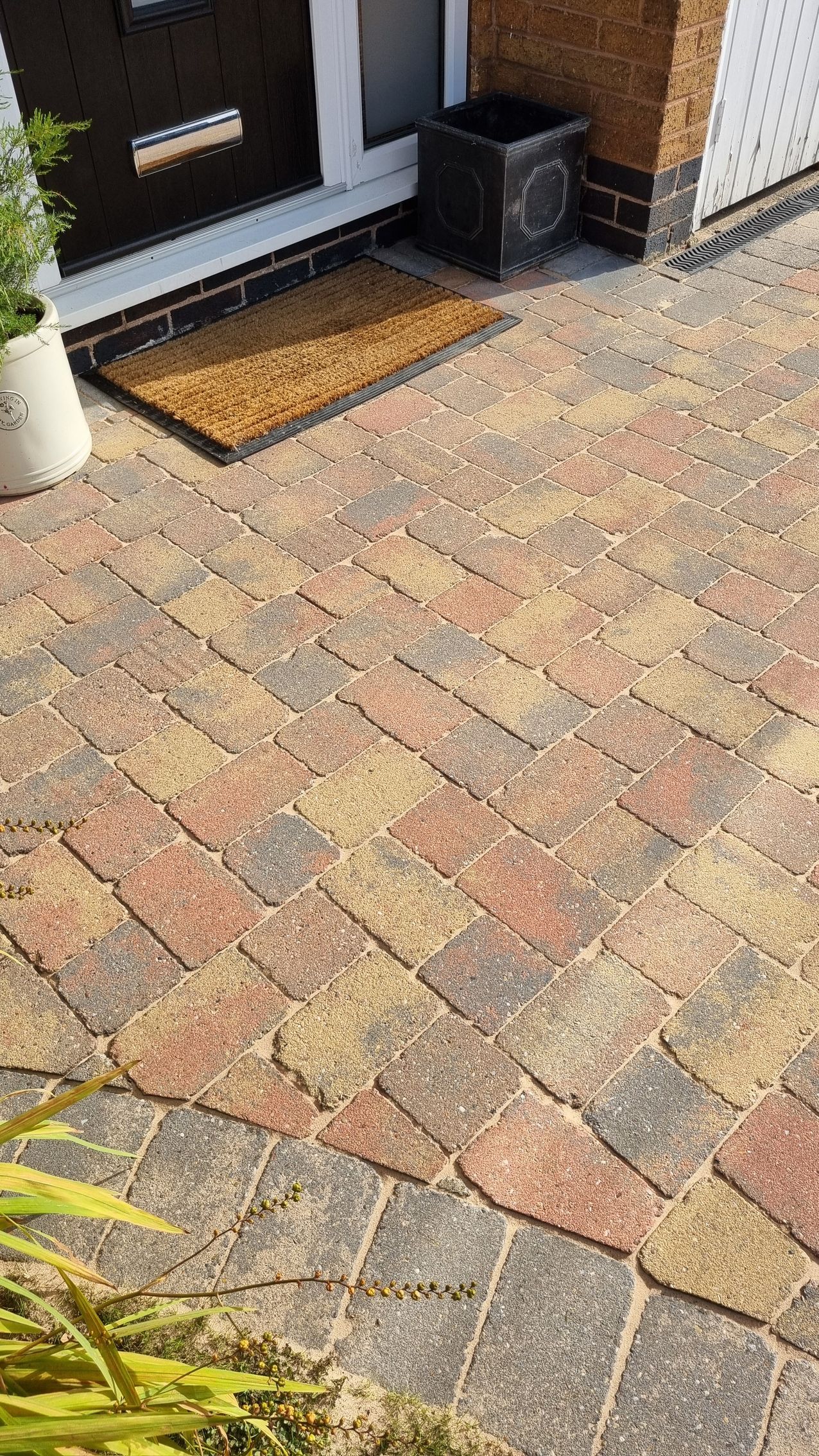 A block paved patio area which bight and colourful after being pressure washed, chemically treated and re-sanded.