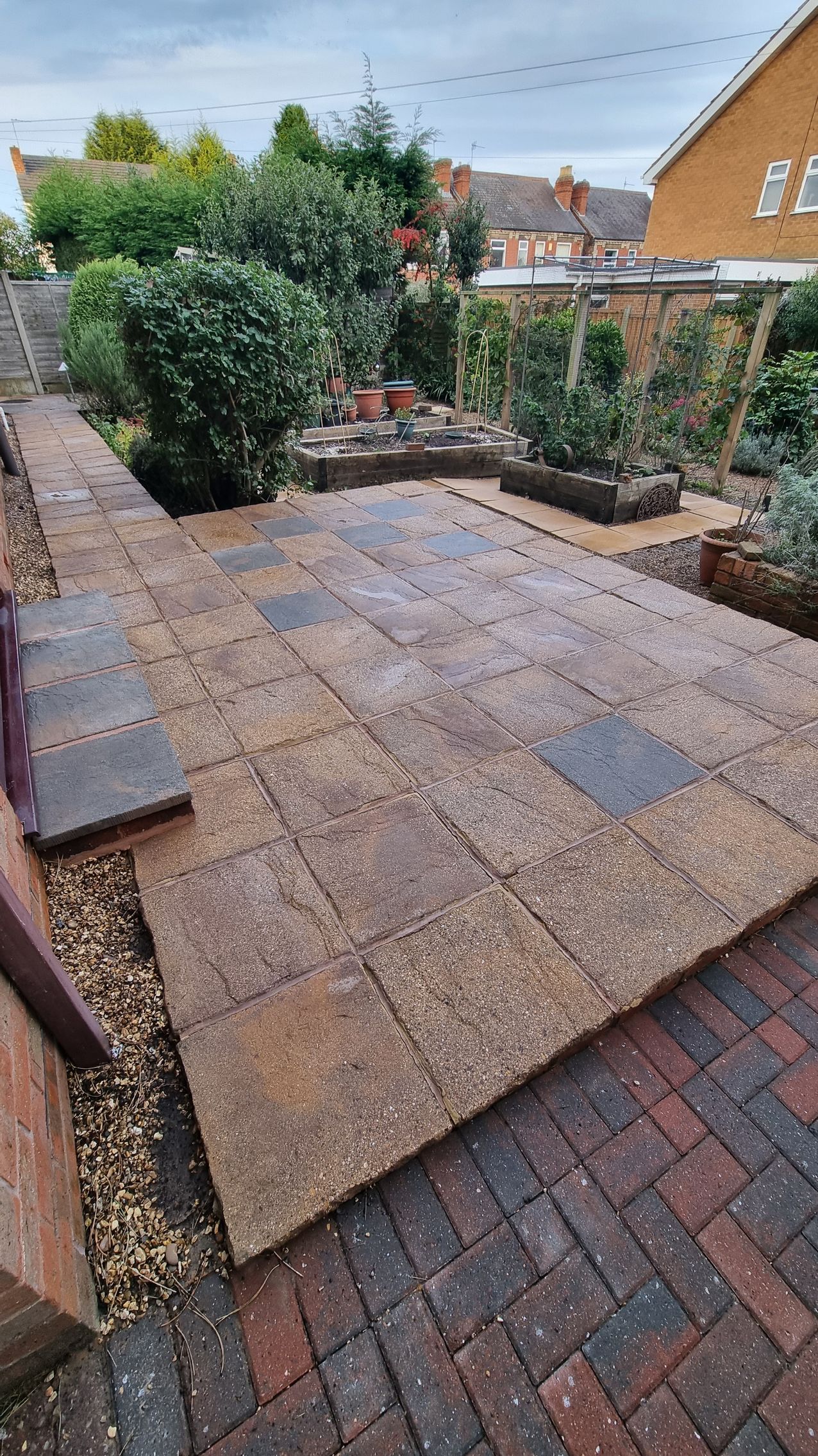 Concrete slab patio that is clean and blackspot free after being pressure washed and chemically treated.