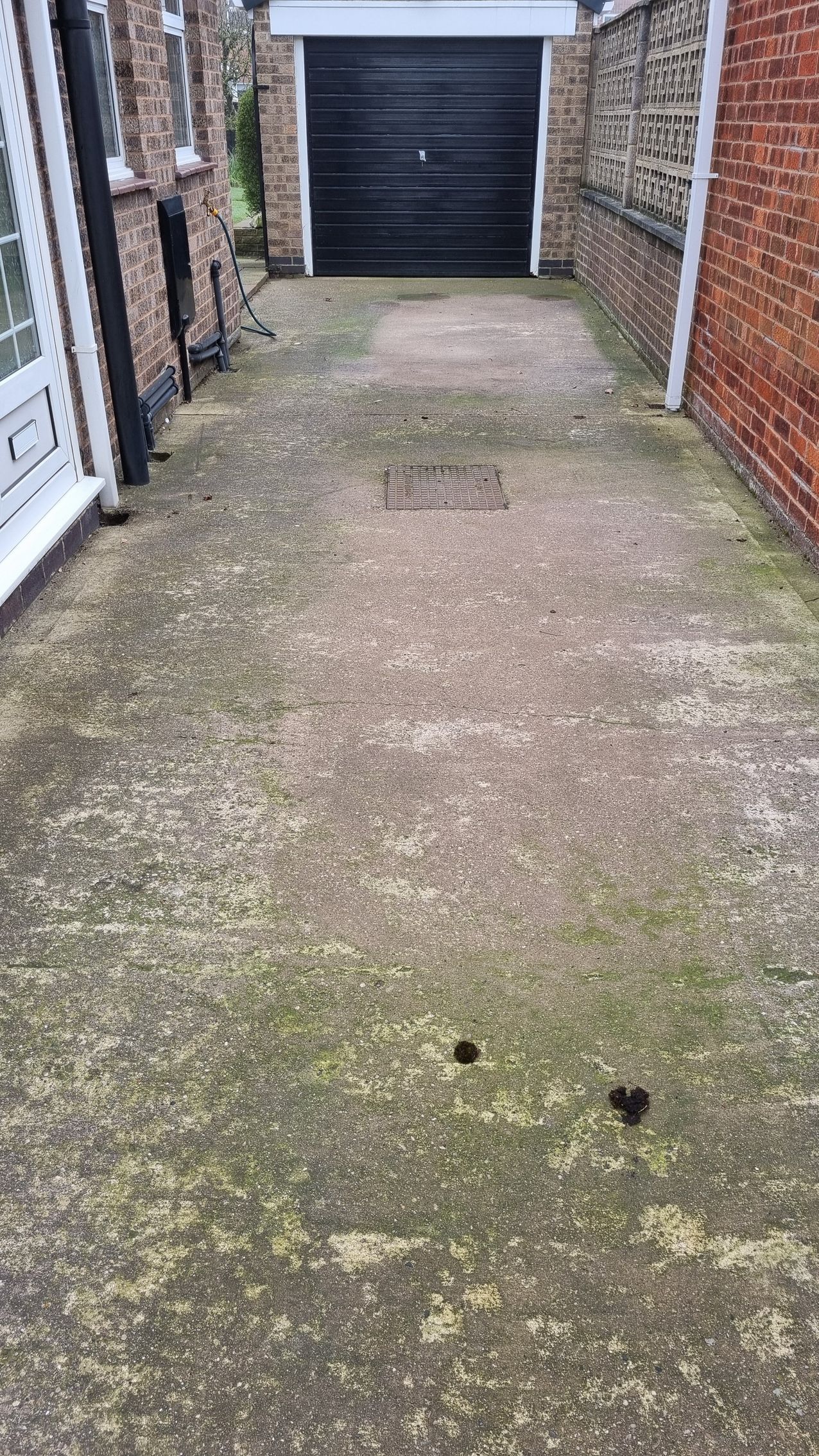 A concrete driveway after a professional driveway clean.