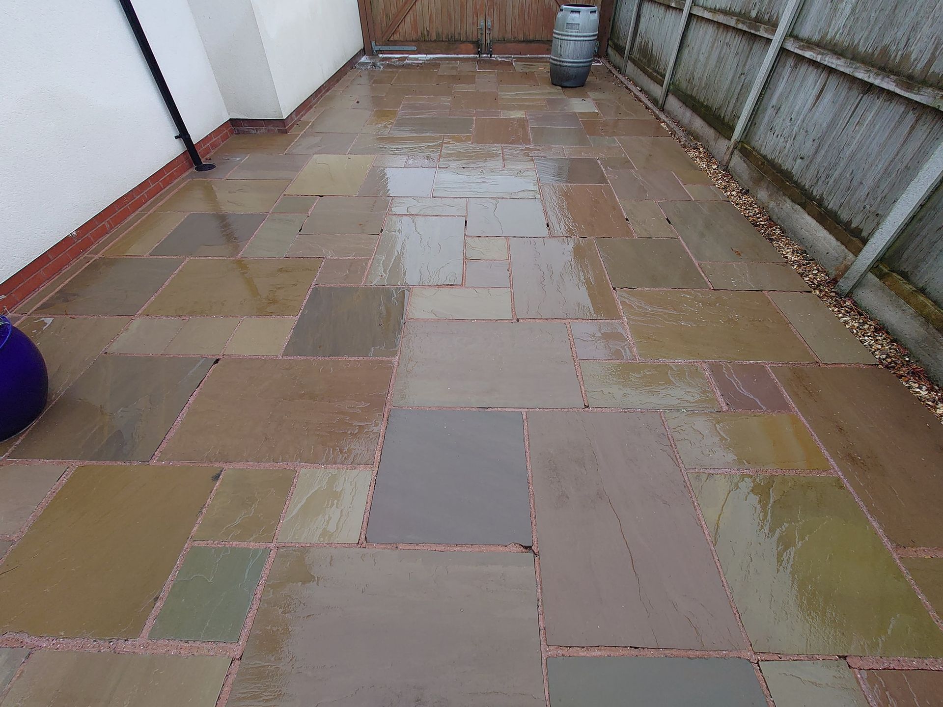 Indian Sandstone patio that is bright and clean after being pressure washed.