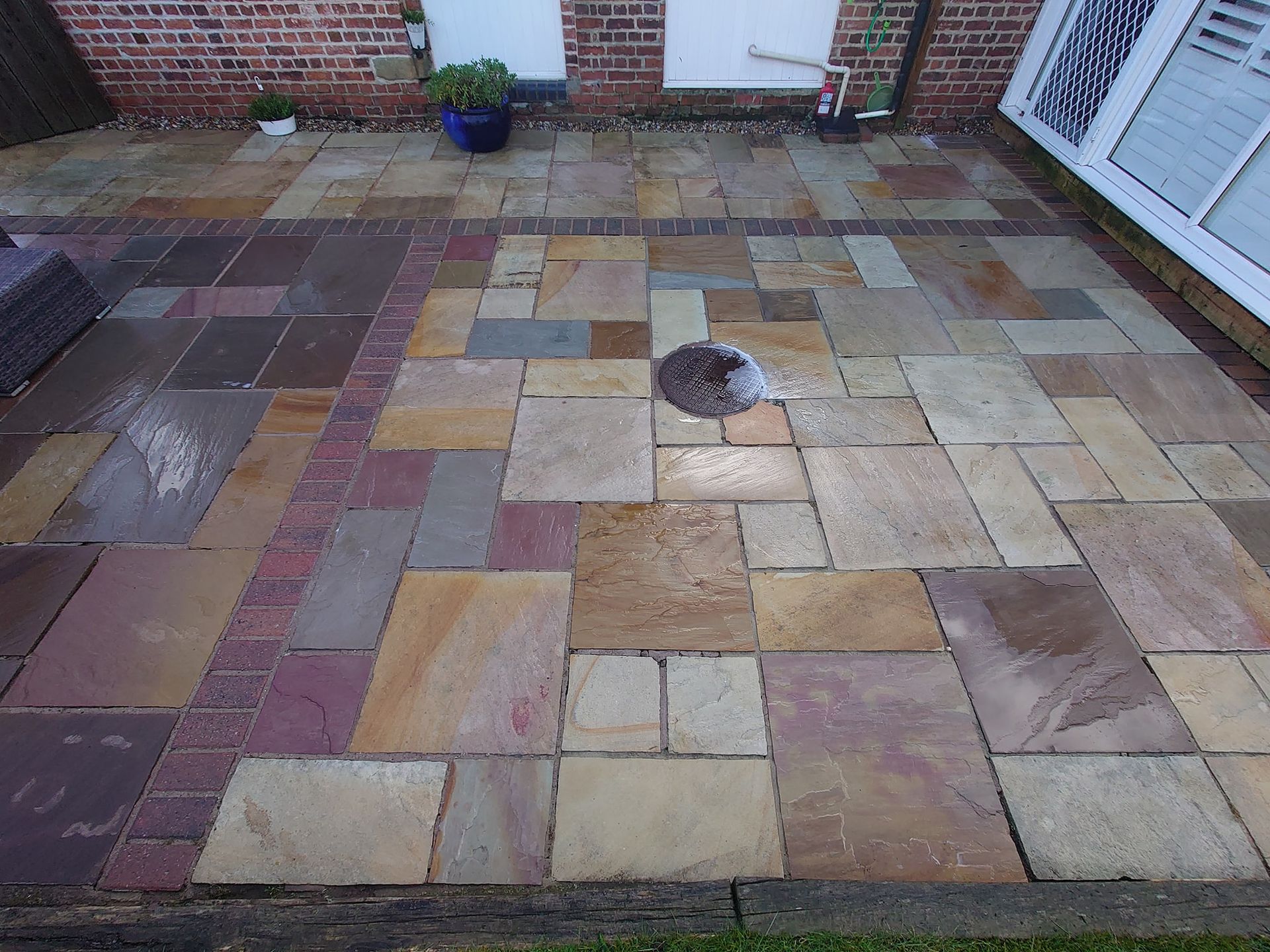 Indian Sandstone patio that is bright and clean after being pressure washed.