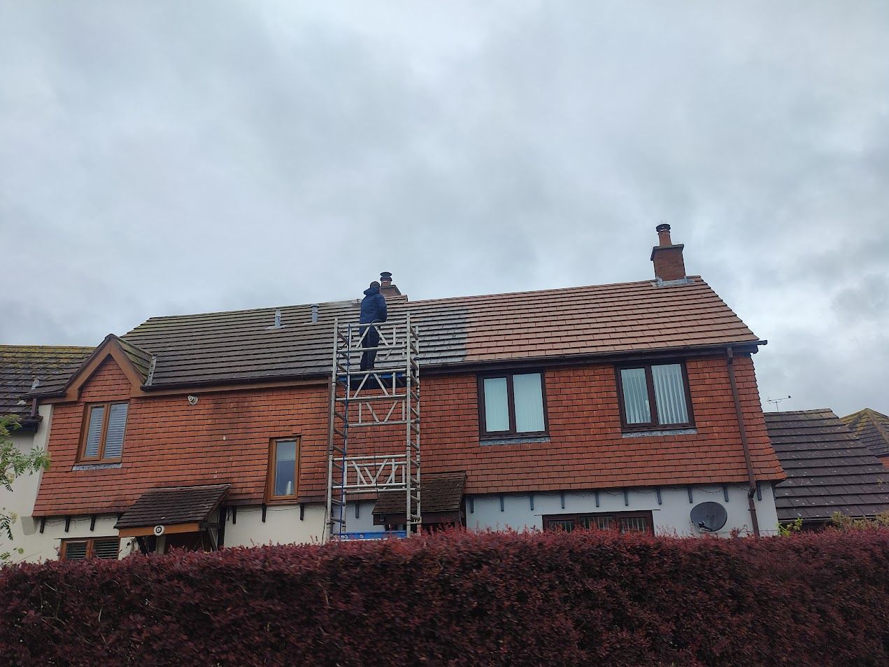 Residential house roof before and after cleaning