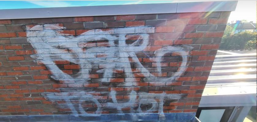 Graffiti on wall before being removed with ThermaTech Steam Cleaner