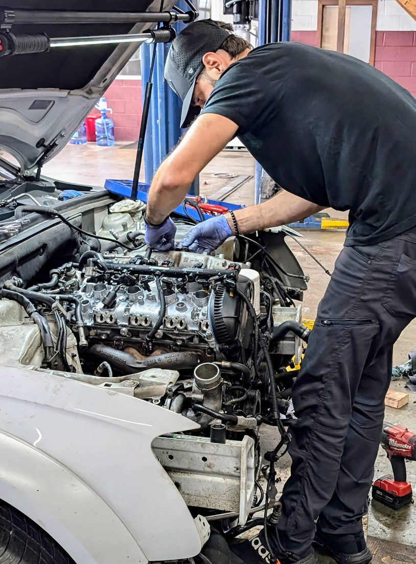 Mechanic Doing Engine Repair | Rollins Automotive