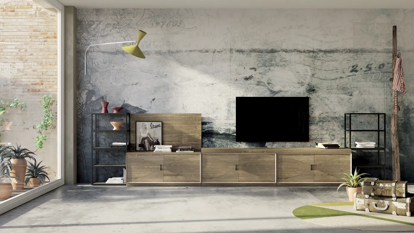 Soggiorno moderno con parete in cemento invecchiato, mobiletto porta TV in legno e ampia finestra.