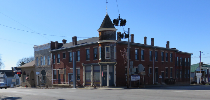A large brick building with a tower on top of it