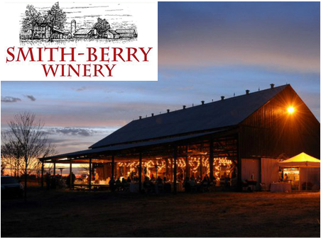 A picture of a barn with a smith-berry winery logo above it