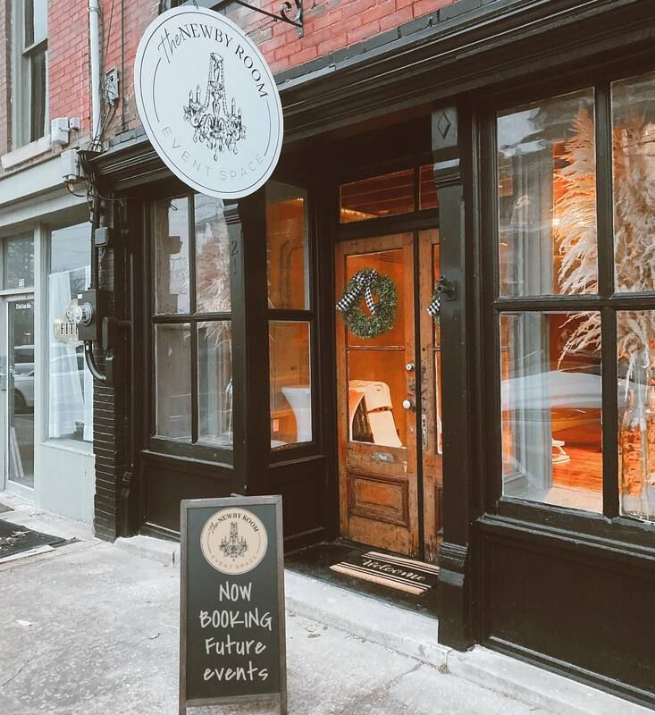 A store front with a sign that says now booking future events