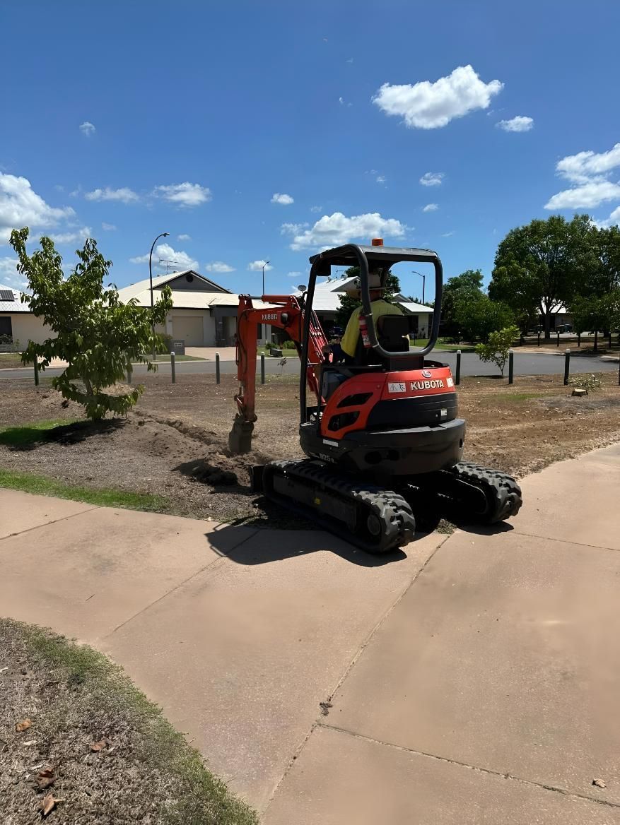 Mini Excavator Digging Next to a Sidewalk — iWater NT Pty Ltd in Yarrawonga, NT