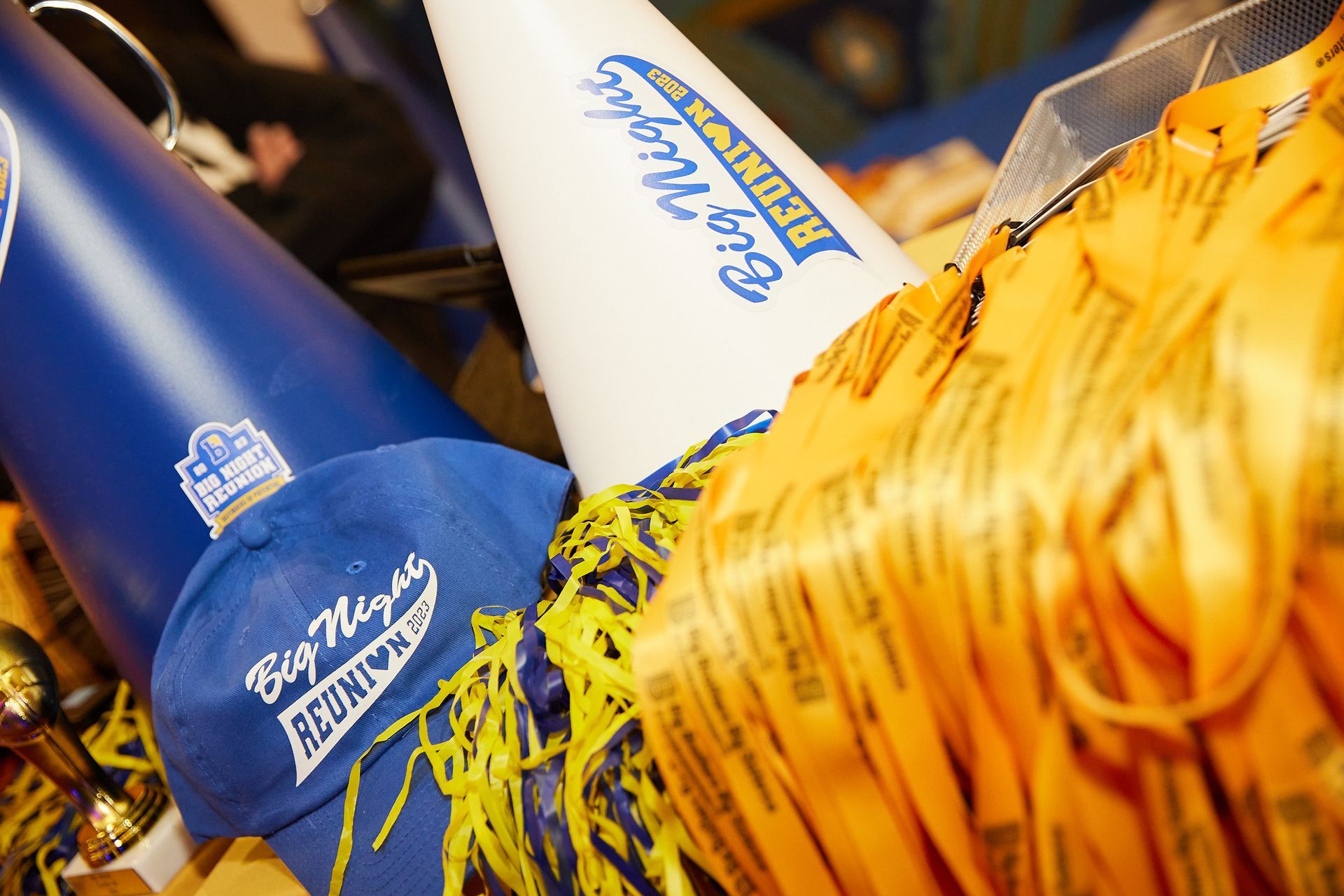 Blue and white cheerleading items with yellow and blue trim;