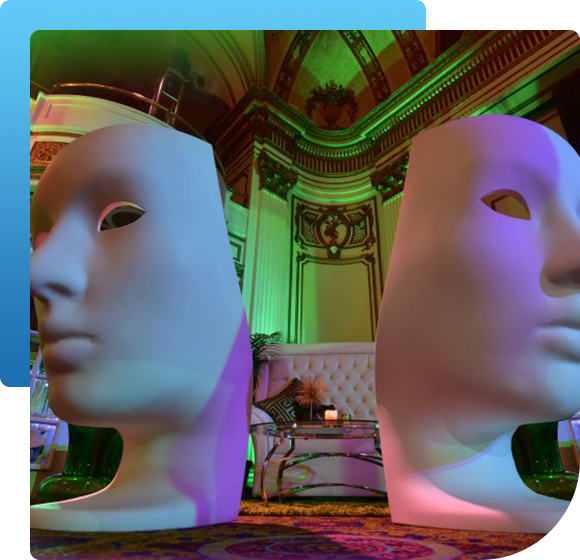 Two mannequin heads are sitting next to each other in a room