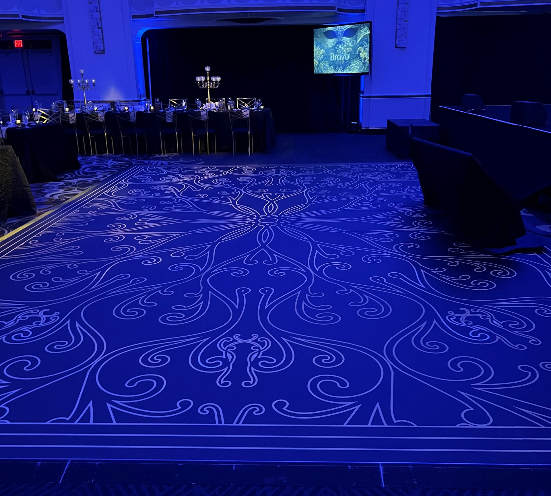 A blue rug with a pattern on it in a room