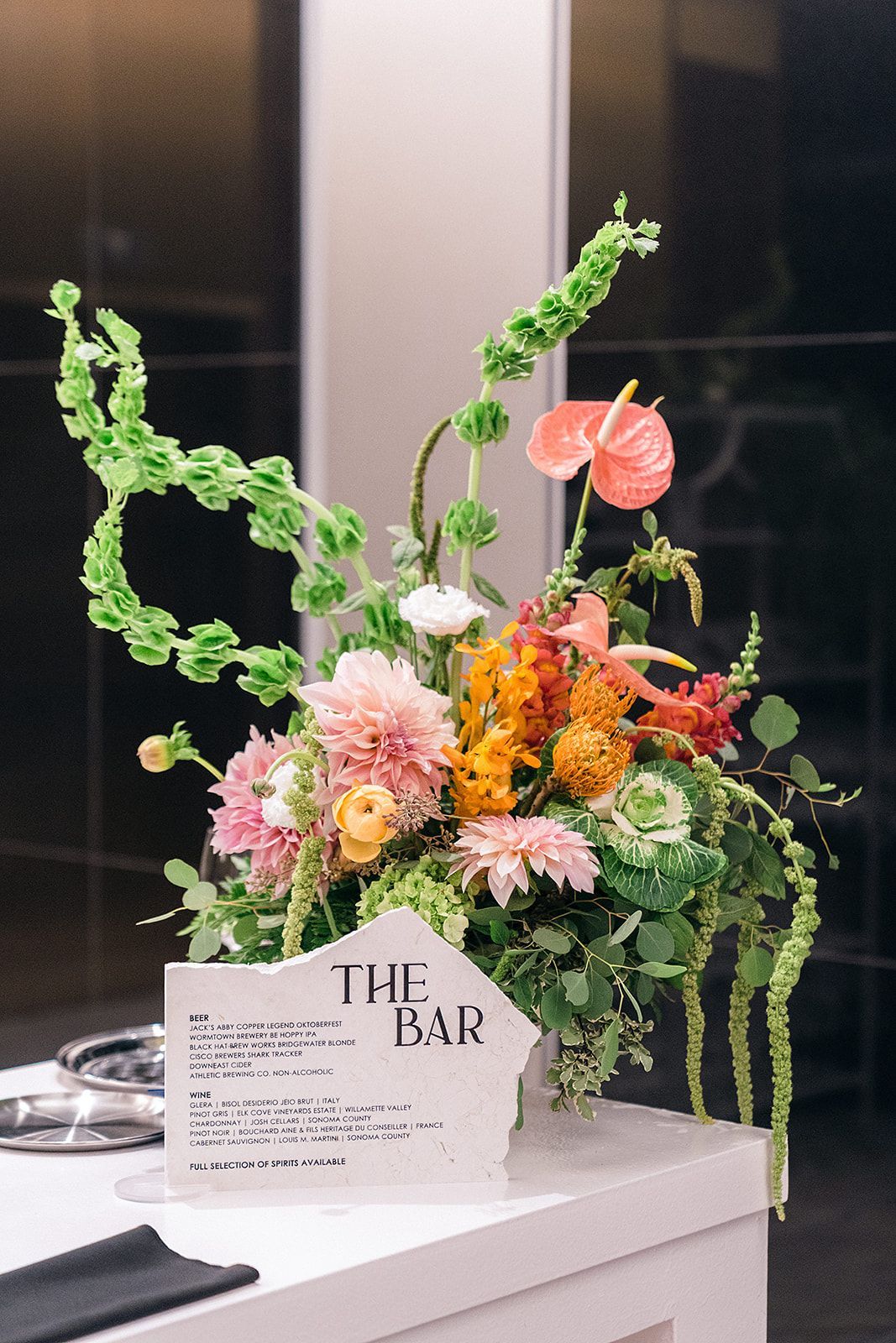 Floral arrangement on a white table with a 