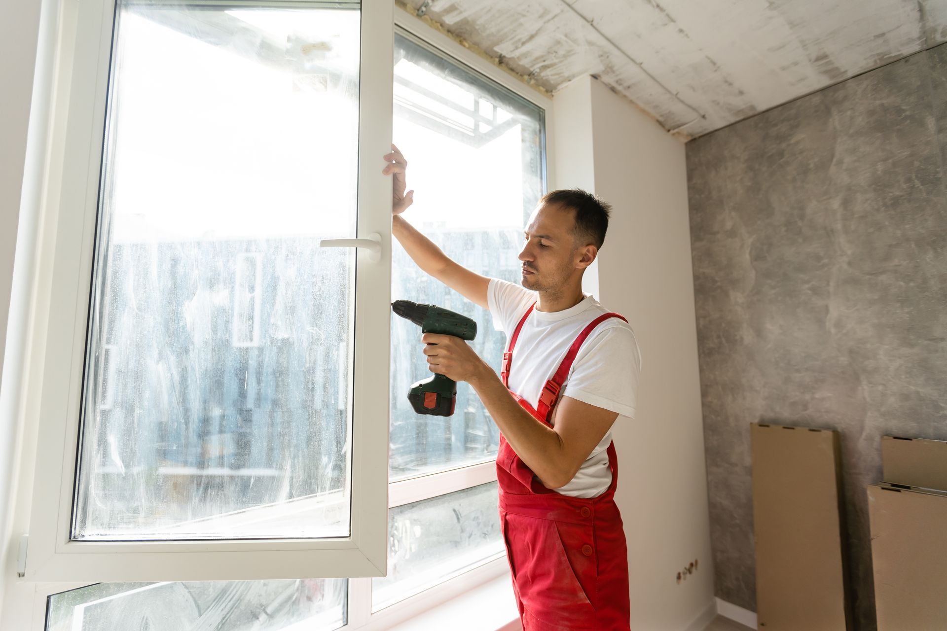 glass expert checking on a double glazed window