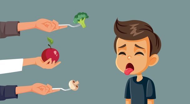 A boy is sticking his tongue out while being offered an apple , broccoli , and mushroom.