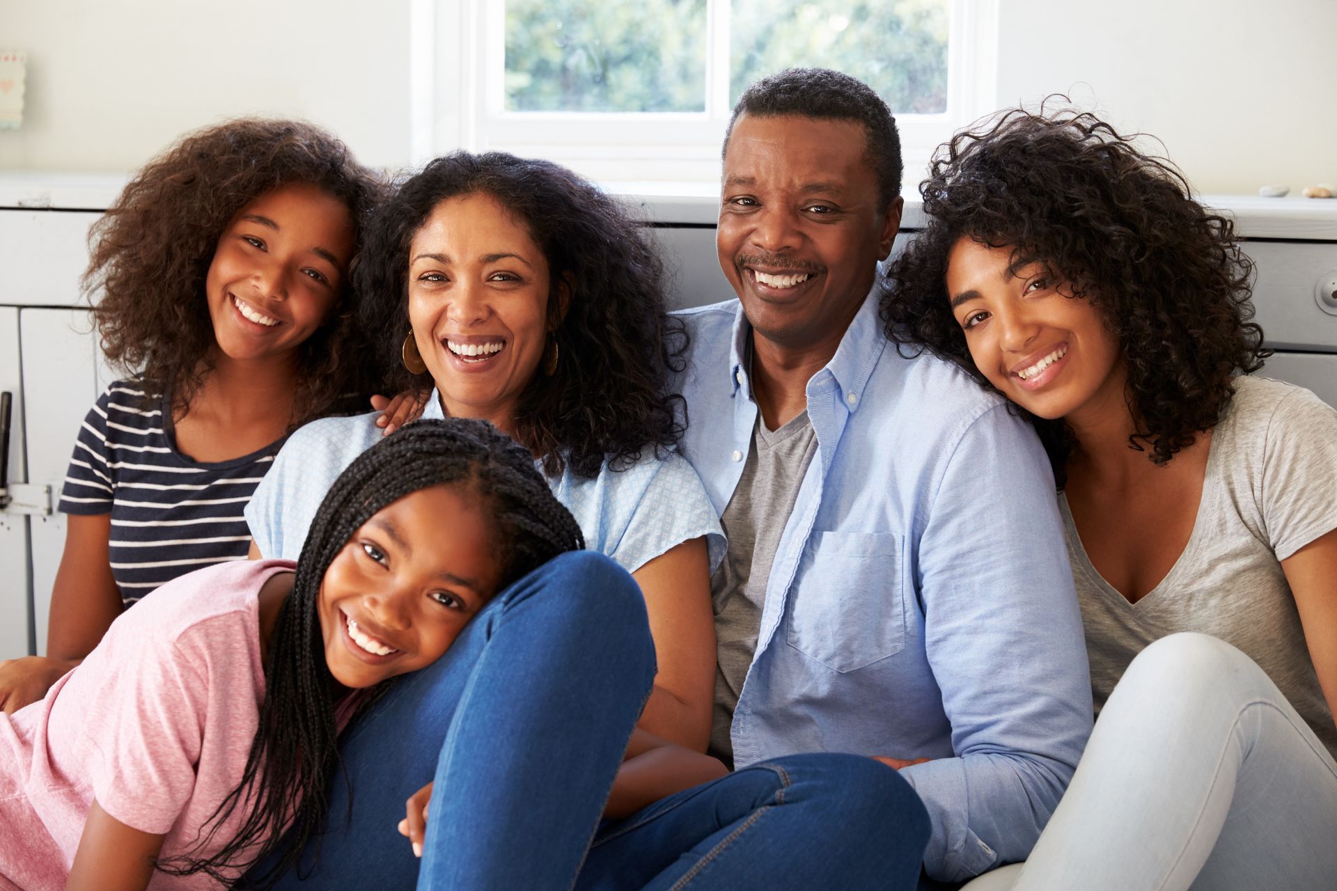 Happy family sitting together