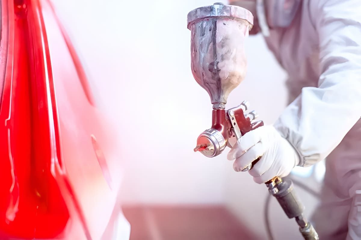 A Car Is Being Sprayed — Mahers Smash Repairs in Walcha, NSW