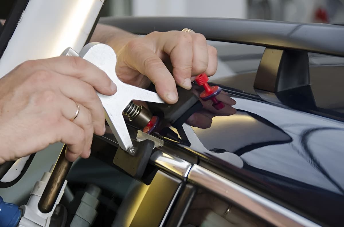 A Person Is Working On A Car With A Tool — Mahers Smash Repairs in Werris Creek, NSW