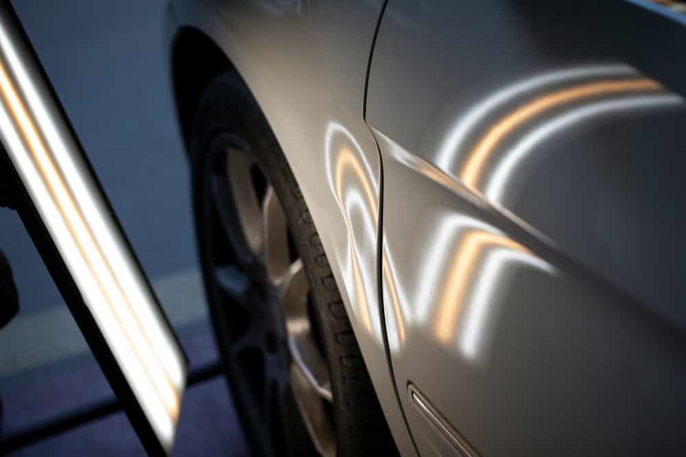 A Close Up Of A Car With A Light Shining On It — Mahers Smash Repairs In Barraba, NSW