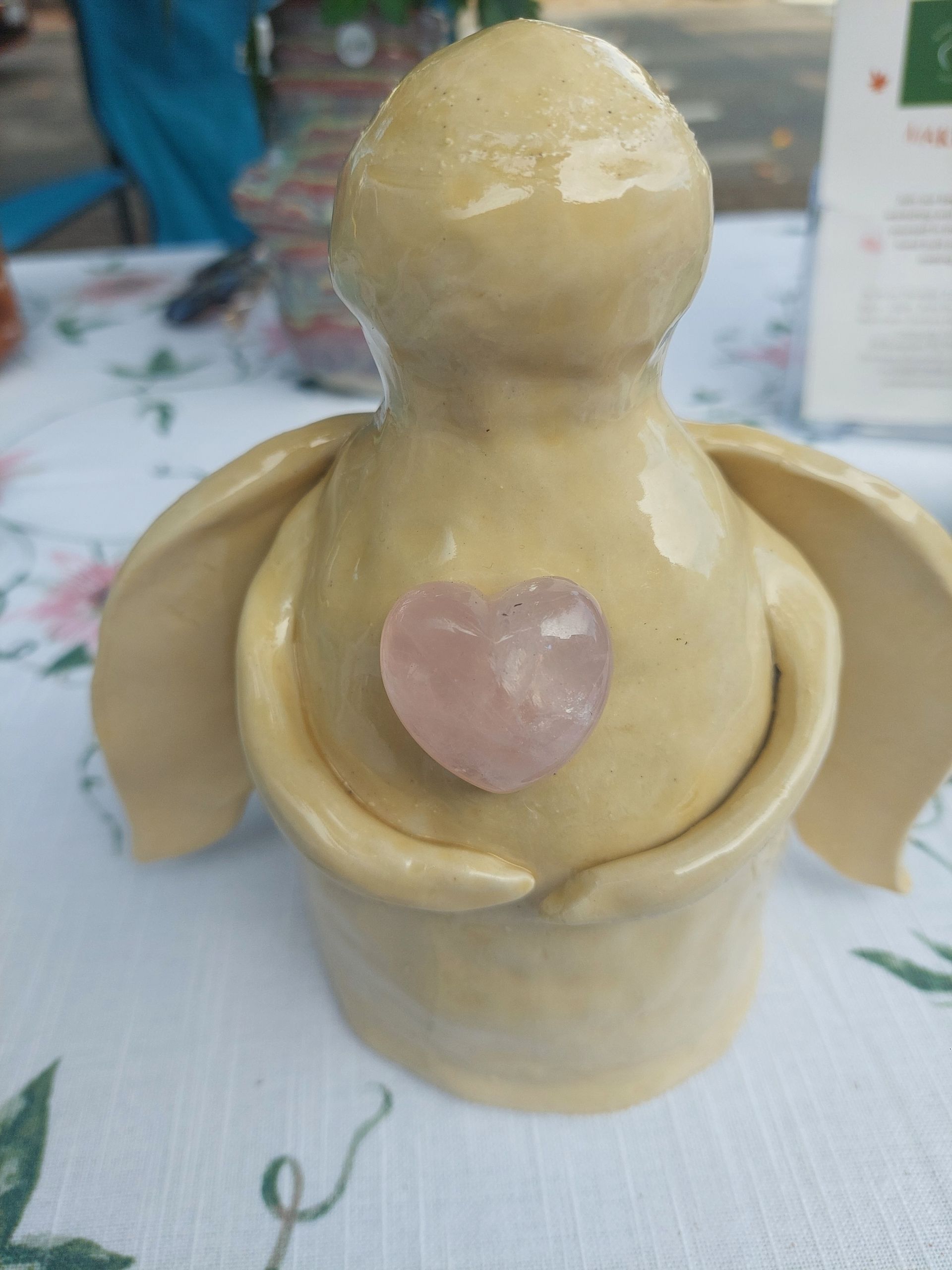 ceramic angel with rose quartz crystal heart