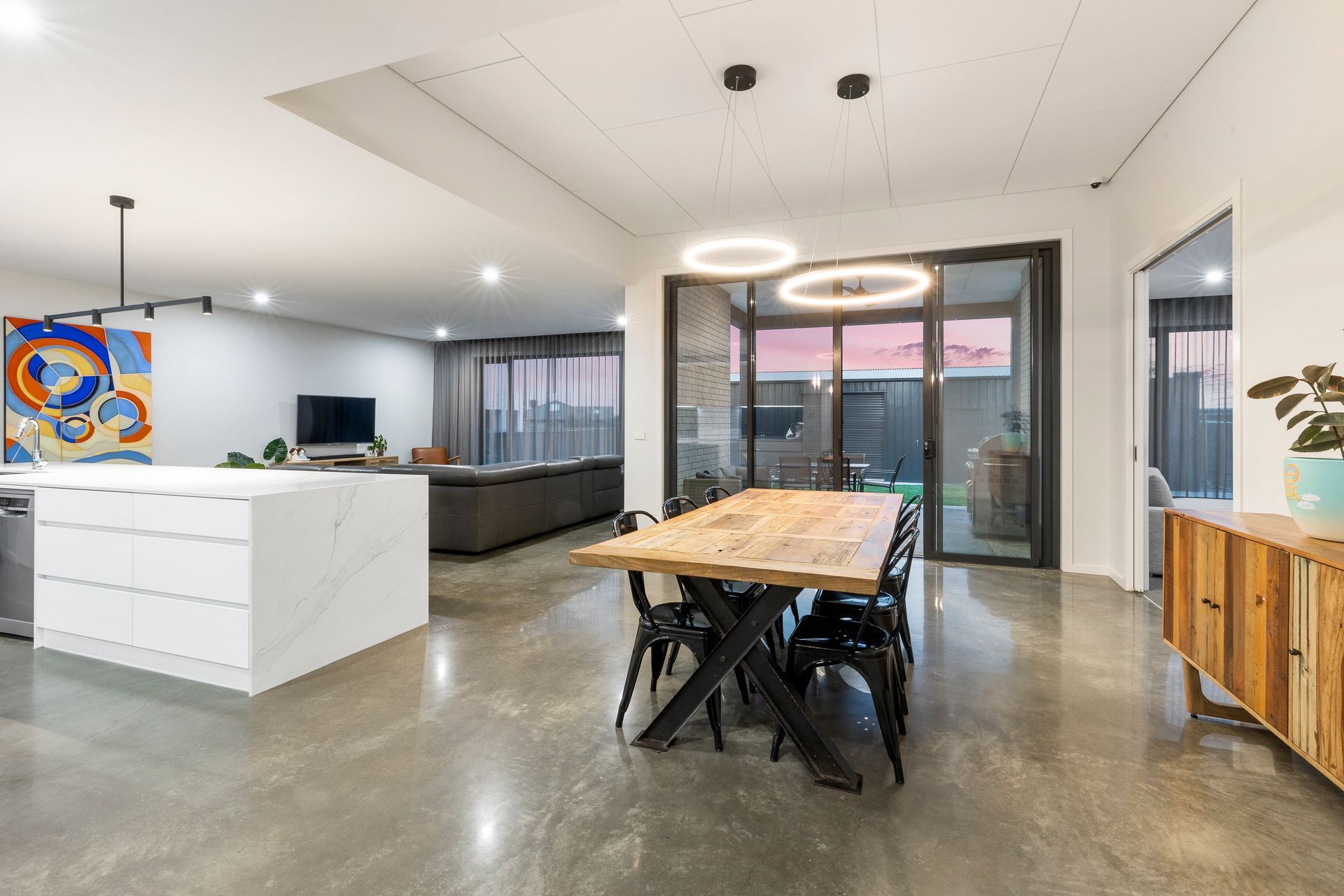 Kitchen With A Large Island and a Large Wooden Kitchen Table— Jetsonian Constructions In Wendouree, VIC