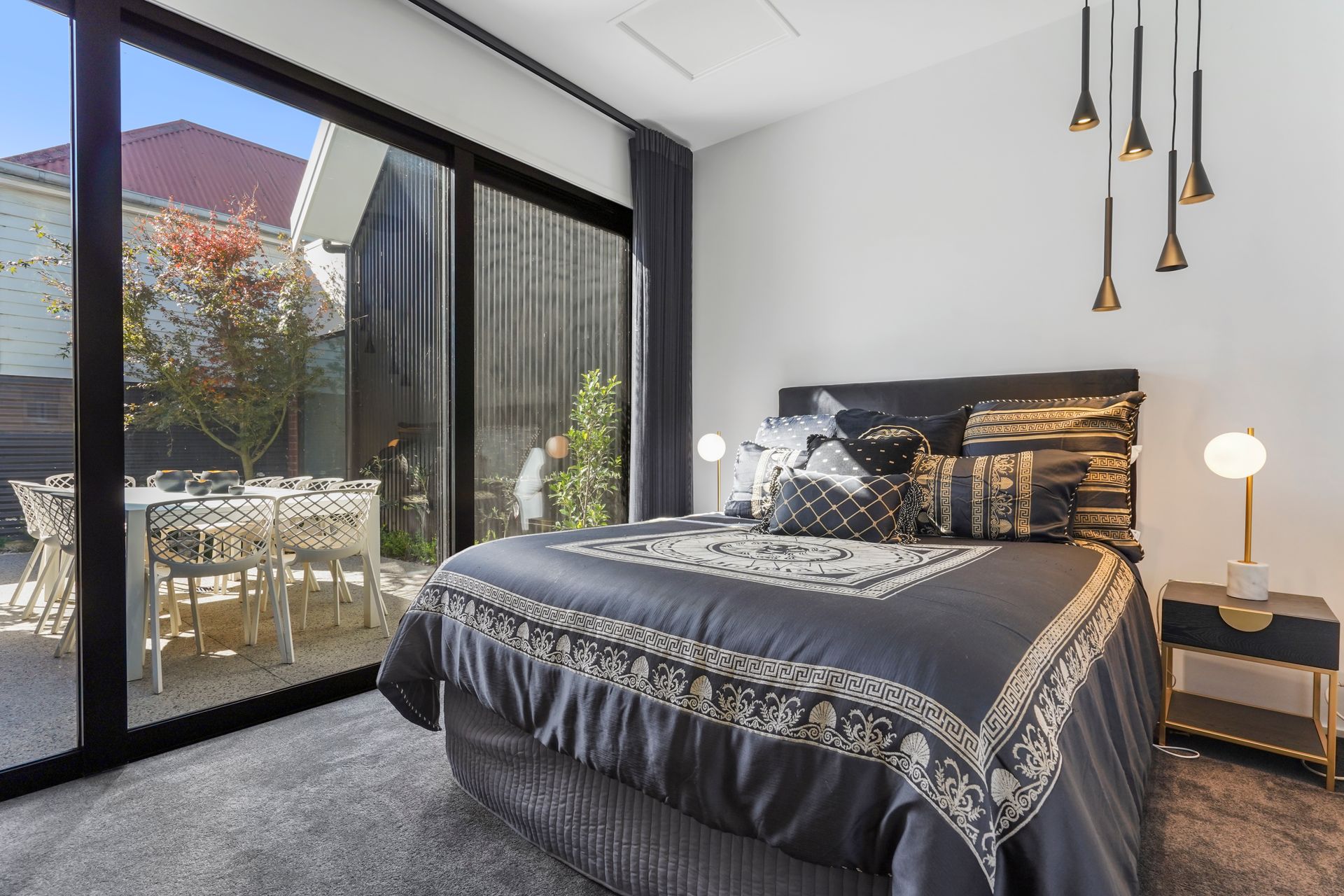 A Bedroom With A Large Bed and A Ceiling Fan — Jetsonian Constructions In Wendouree, VIC