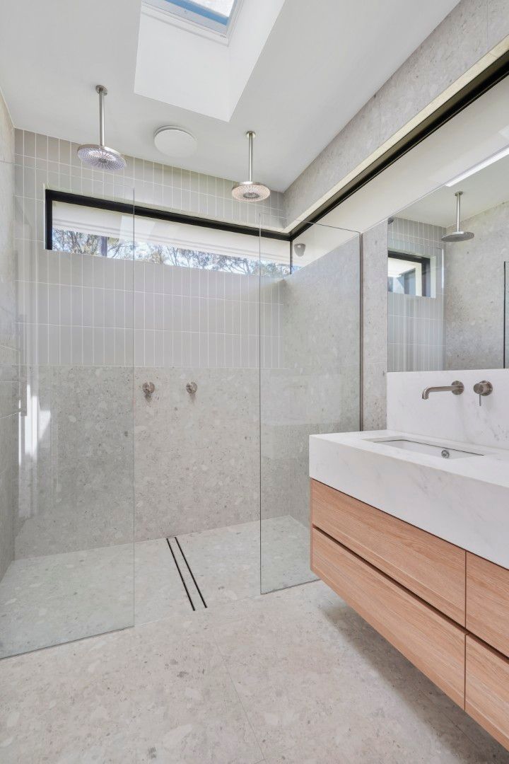 Modern Bathroom With Tiled Shower, Skylight, and Floating Wood Vanity With Sink — Jetsonian Constructions In Wendouree, VIC