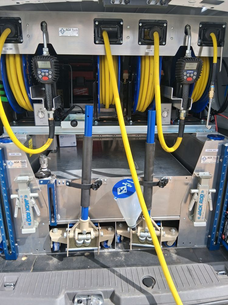 Industrial machine with yellow hoses, blue components, and metal fixtures inside an equipment cabinet