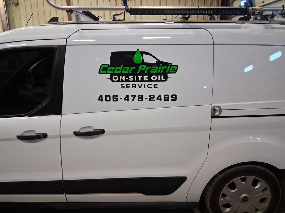 White van with Cedar Prairie On-Site Oil Service logo and phone number on the side