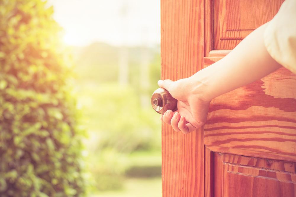 Hand Opening Wooden Front Door — Lock Repairs in Home Hill, QLD
