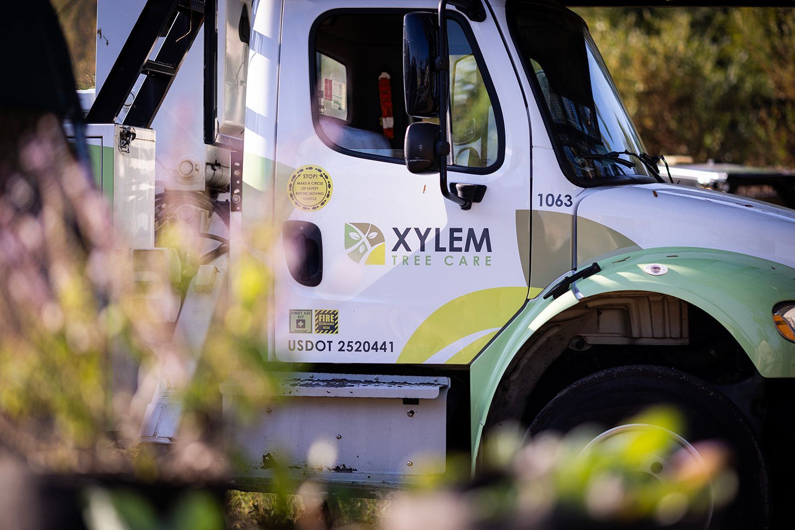 A white and green xylem tree care truck — Norfolk, VA — Xylem Tree Care A white and green xylem tree care truck — Norfolk, VA — Xylem Tree Care
