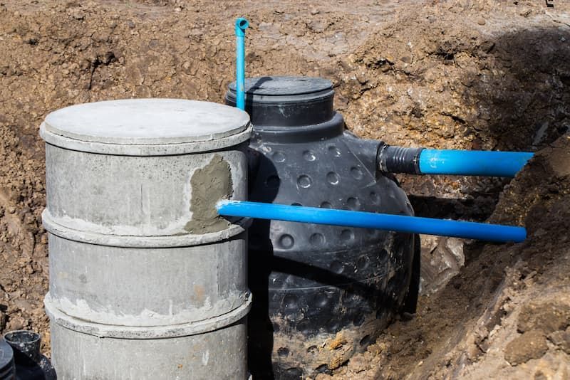A Septic Tank is Sitting in the Middle of a Dirt Field — Mid Coast Liquid Waste In Forster, NSW
