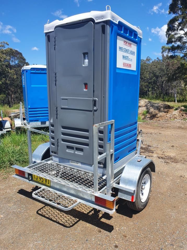 A Blue and Gray Portable Toilet is on a Trailer — Mid Coast Liquid Waste In Harrington, NSW