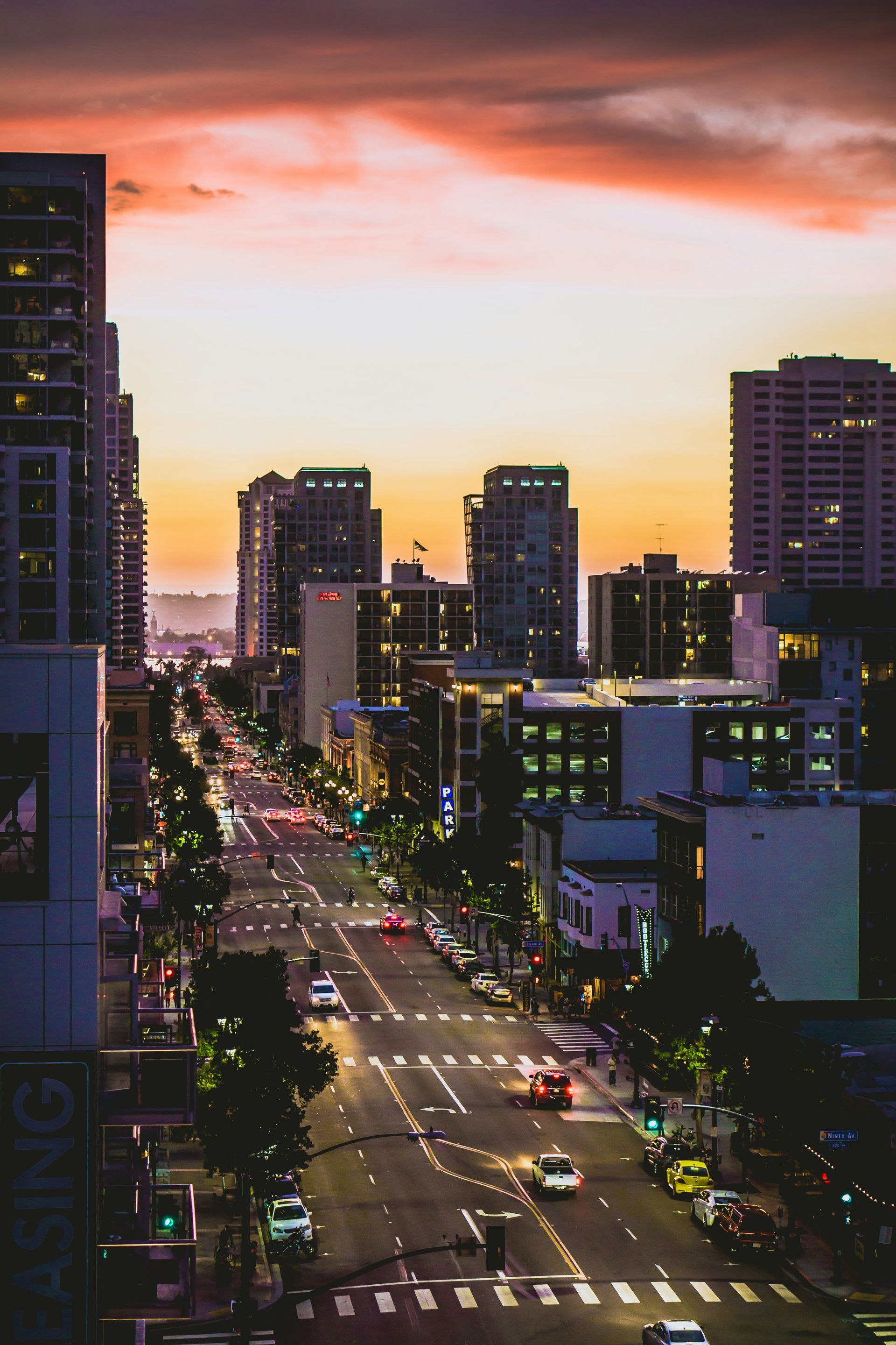 An aerial view of a city street at sunset