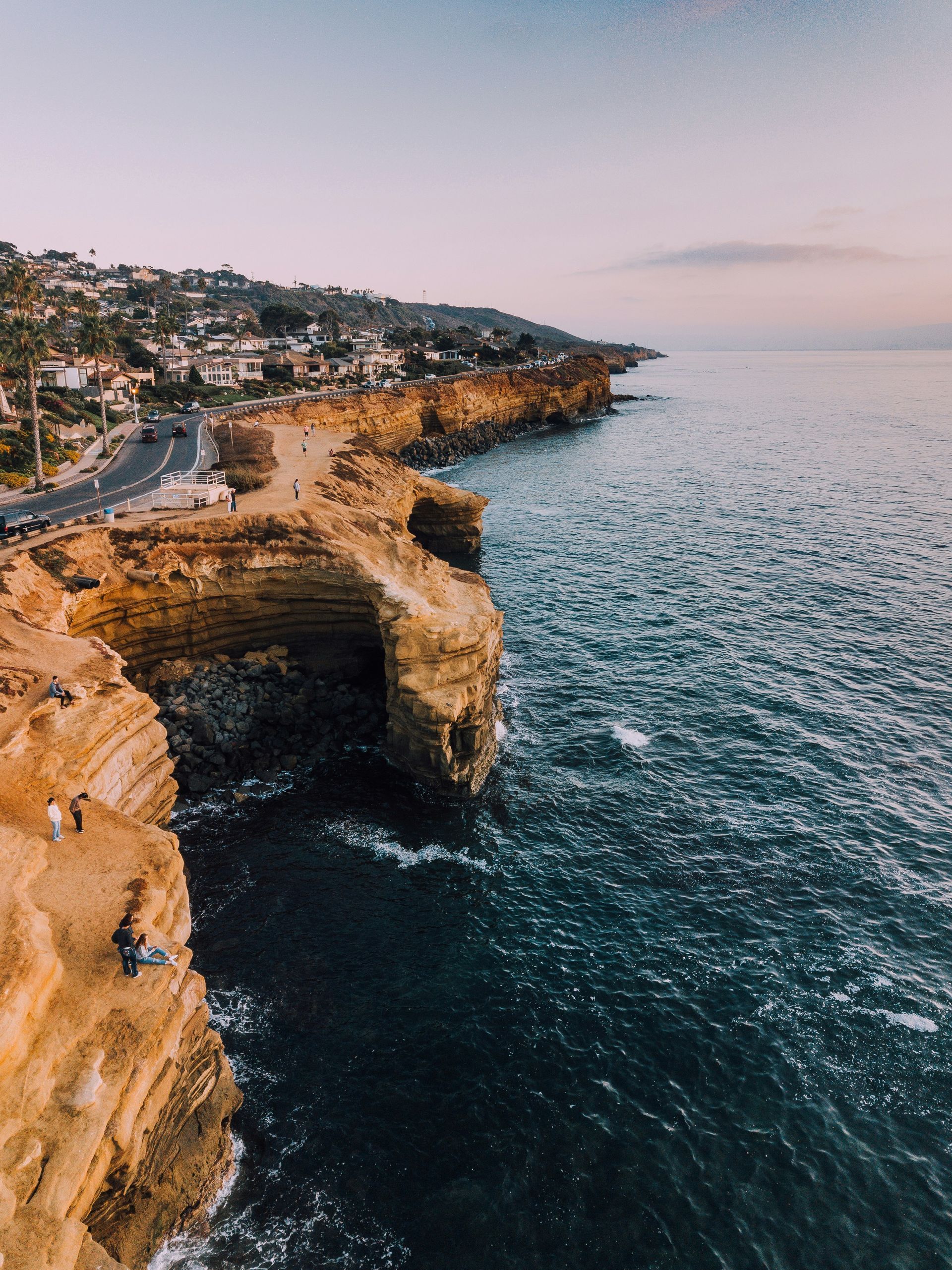An aerial view of a cliff overlooking the ocean.