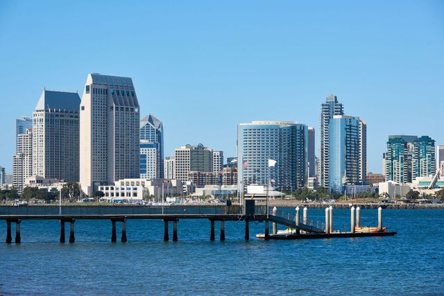 A city skyline with a dock in the foreground