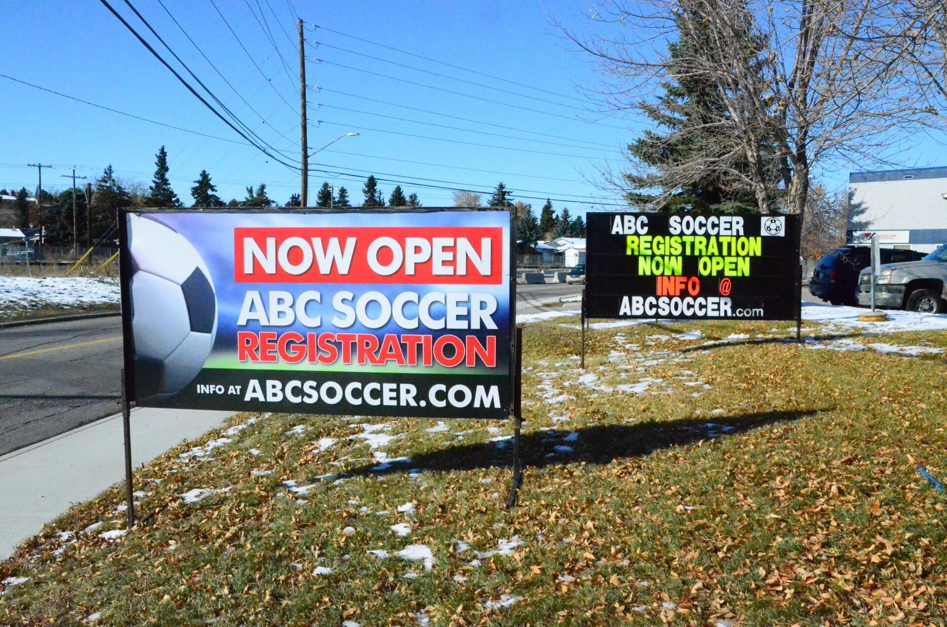 A sign that says now open abc soccer registration