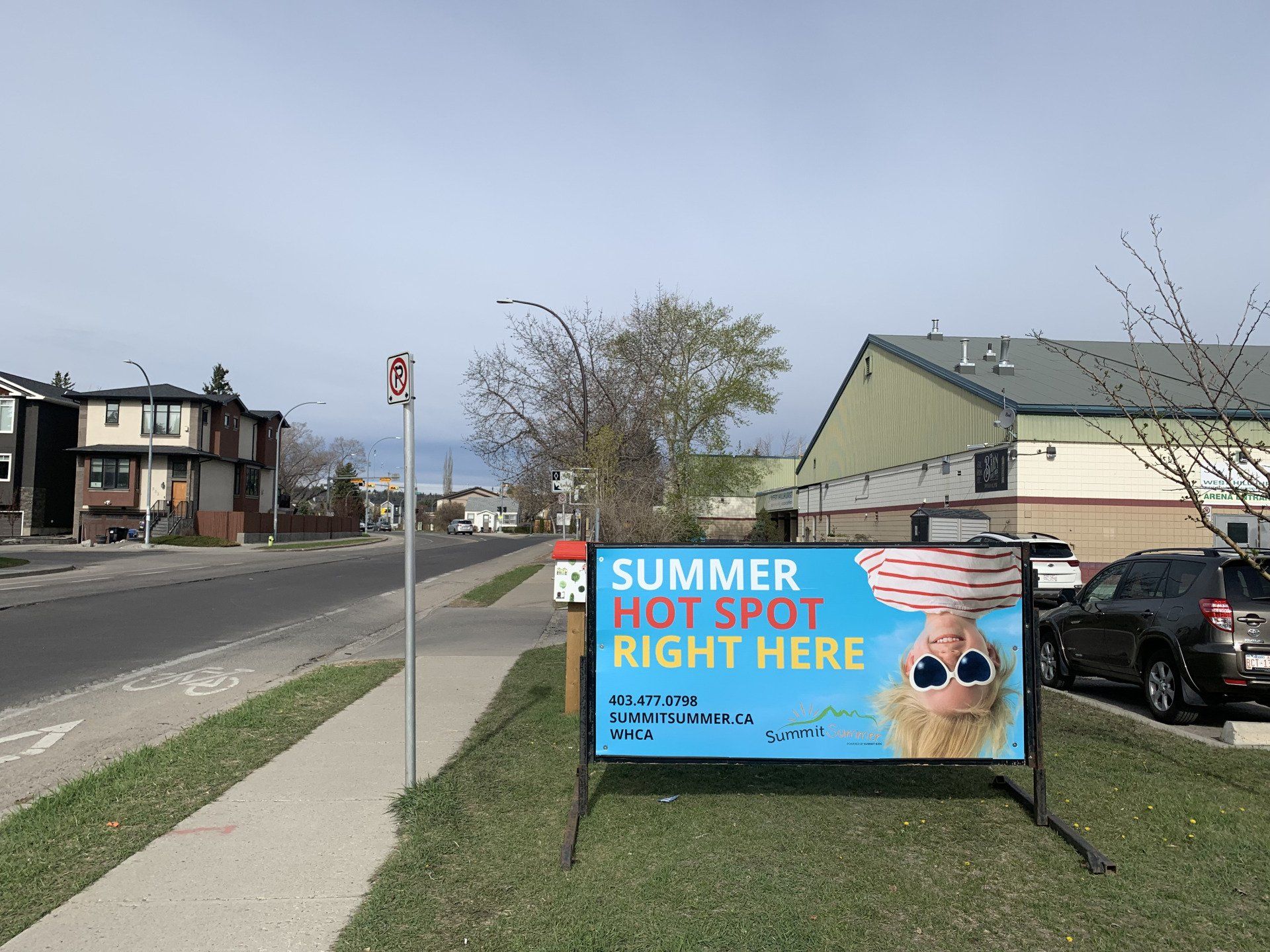 Sign on sidewalk: