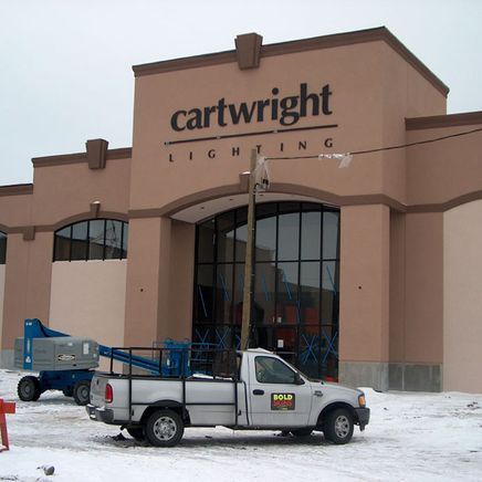 Exterior of Cartwright Lighting store; a pickup truck and lift are parked out front.