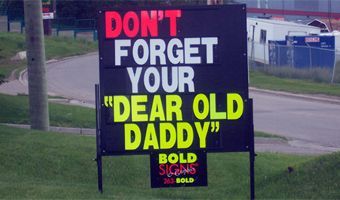 A sign that says do n't forget your dear old daddy