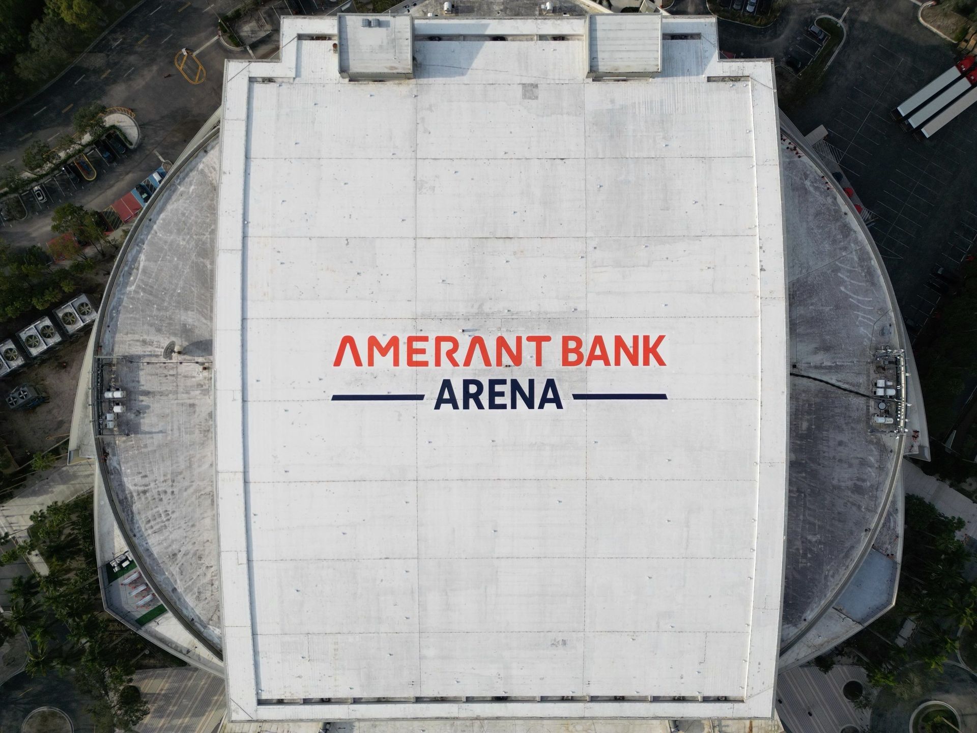 Aerial view of Amarant Bank Arena roof with large red and blue logo.