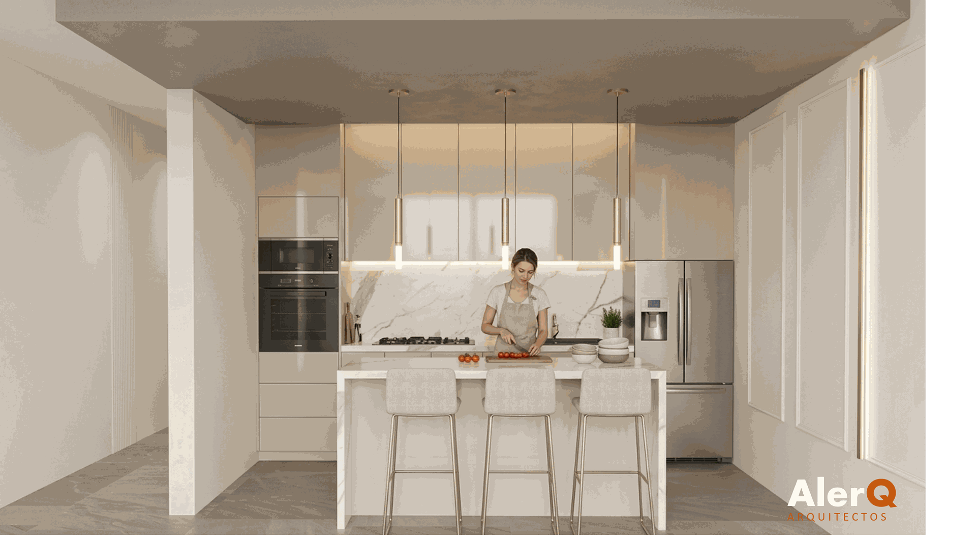 Cocina moderna de color blanco con isla, lámparas colgantes y una persona preparando comida.
