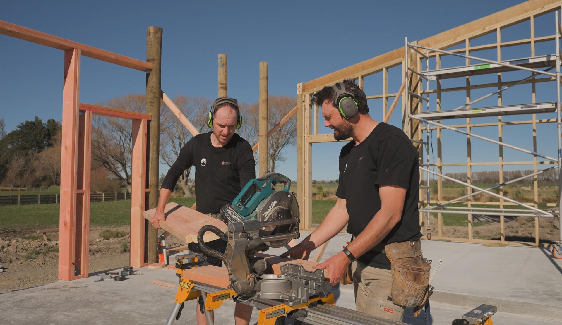 Reinholt Builders team reviewing architectural plans on site