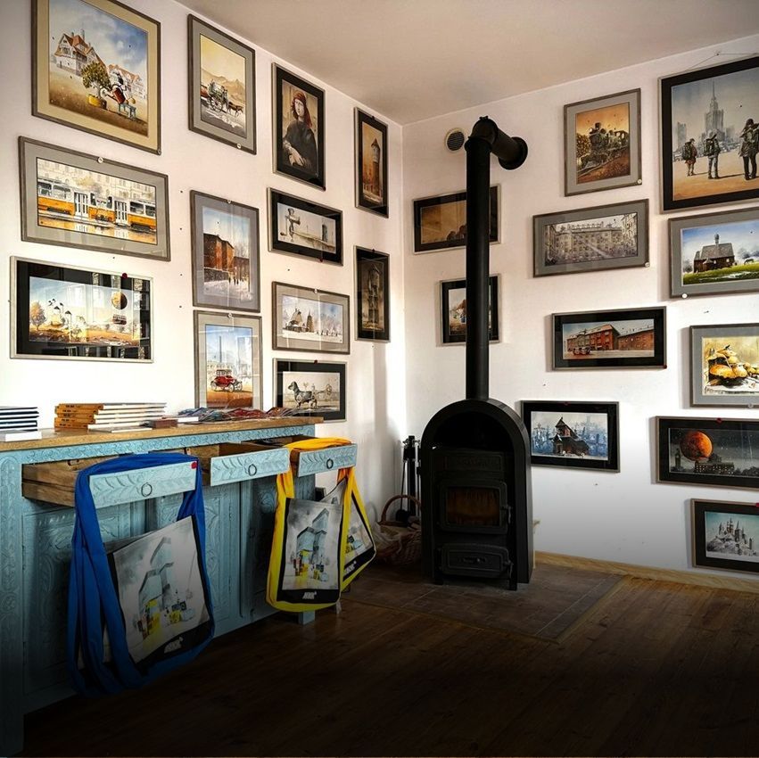 Grzegorz Chudy Watercolour Atelier with a lot of pictures on the wall