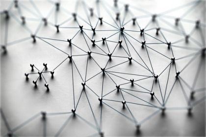 Abstract network of connected nodes and lines on a light background, suggesting a digital communication network